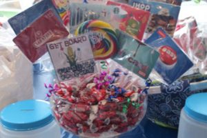 A raffle basket full of candy and gift cards