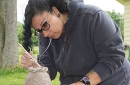 A student working on a ceramics piece during a class at the farm