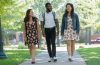 Three students walking across the Case Western Reserve University campus