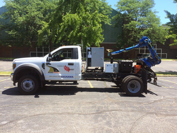 Heavy-duty truck with mechanical arm attached