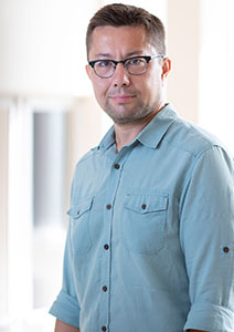 photo of erman ayday in a blue shirt